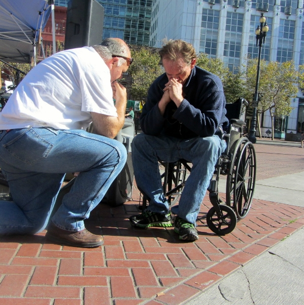 LARRY DUBOIS PRAYS WITH MAN (PAUL) AT UN PLAZA